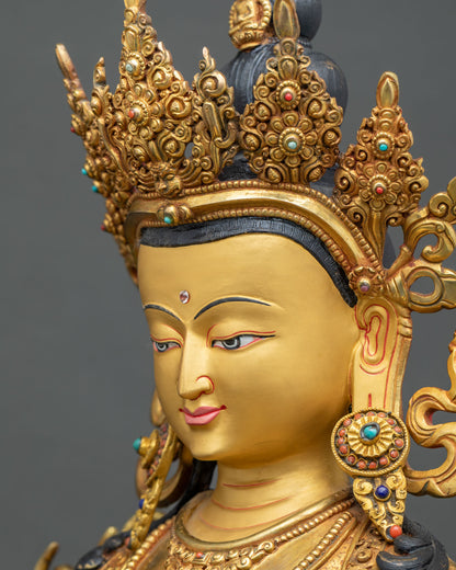 Three-quarter view of Chenrezig statue face with hand-painted eyes and intricate jeweled crown