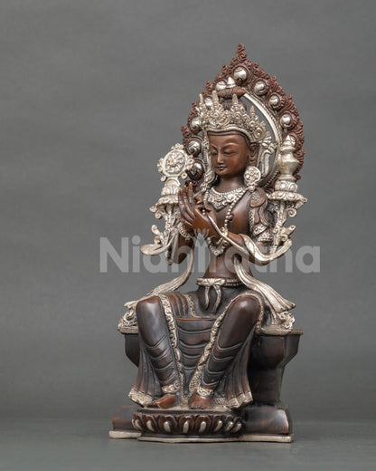 Three-quarter view of Future Buddha Maitreya statue seated on lotus base and ornate throne