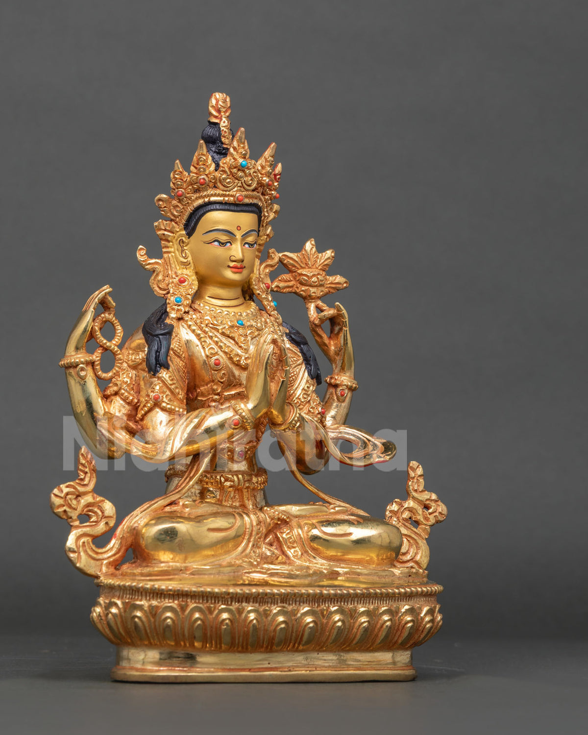Three-quarter view of gold Chenrezig (Avalokiteshvara) statue with ornate five-jewel crown, Nepal