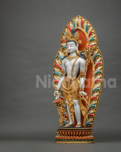 Three-quarter view of Padmapani Lokeshvara statue holding utpala flower, gold gilded copper sculpture