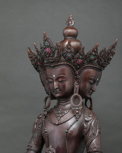 Three-quarter view of Sarvavid Vairocana’s four faces beneath an ornate gemstone-set copper crown
