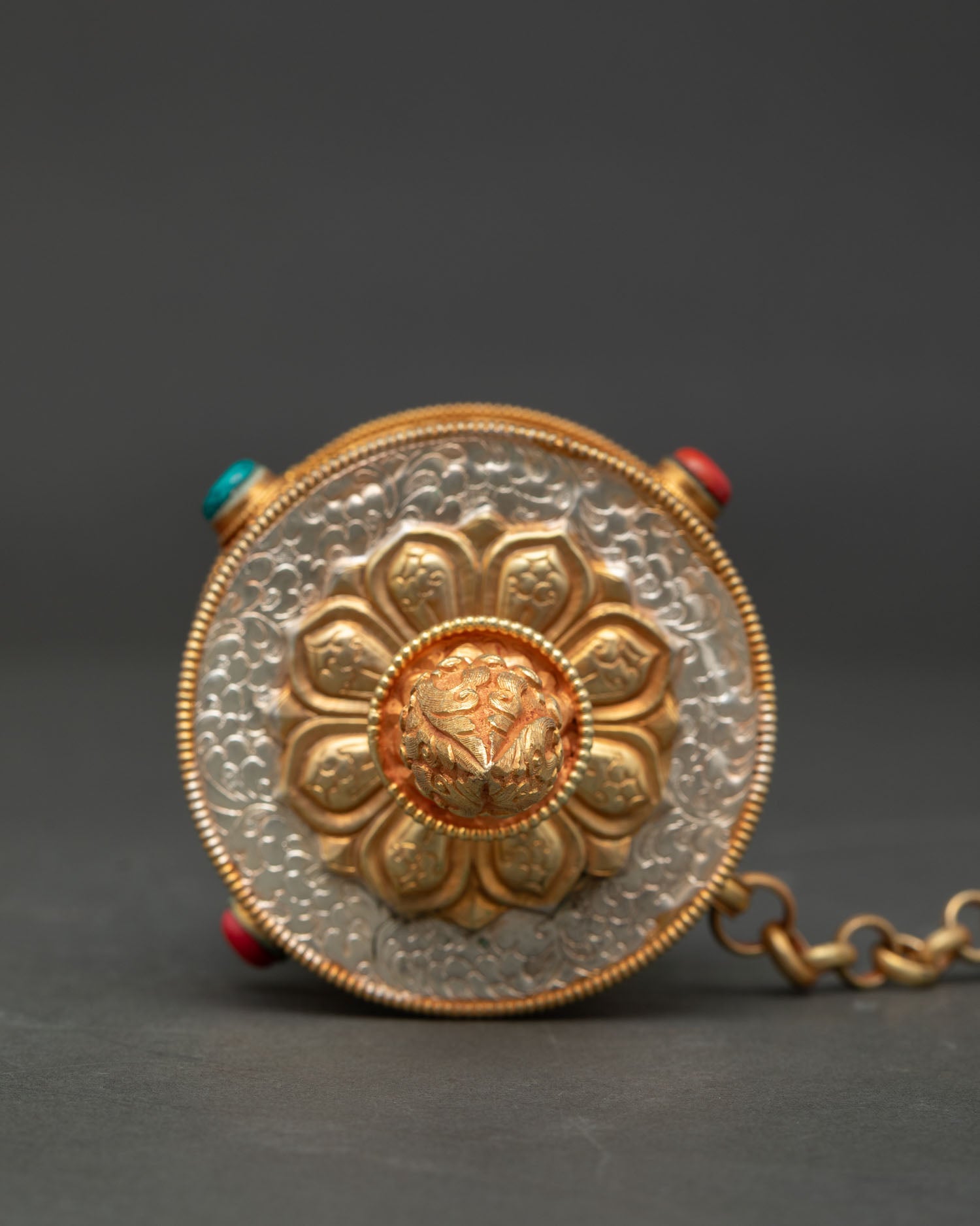 Tibetan prayer wheel from patan nepal with gold plated carved mandala designs.
