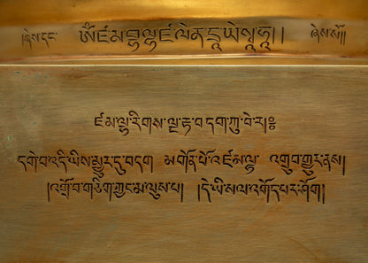 Tibetan script inscription engraved on the base of Dzambhala Statue