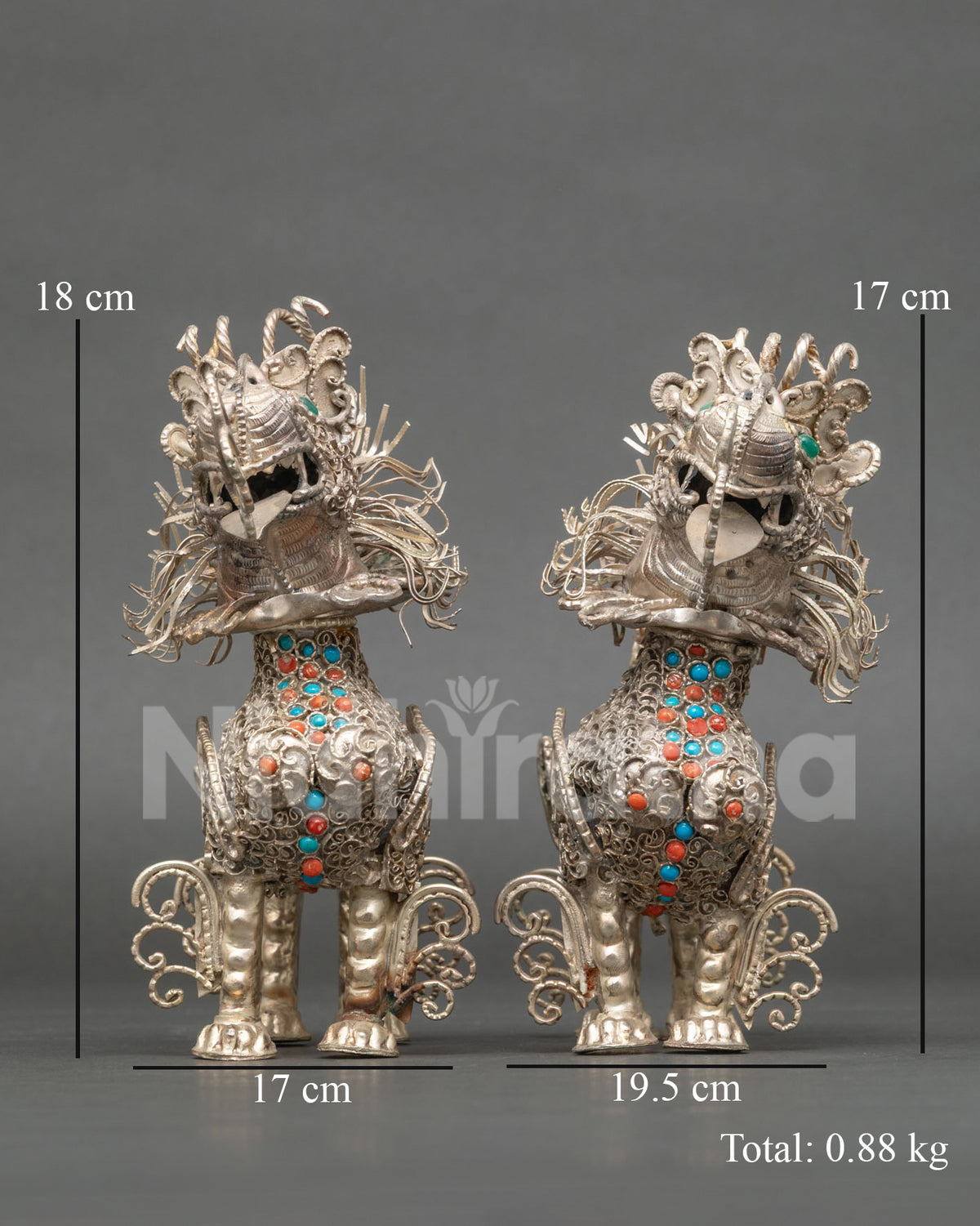 Tibetan Snow Lion Set handcrafted from copper with a silver plated finish by a Newari artist from Patan Nepal.