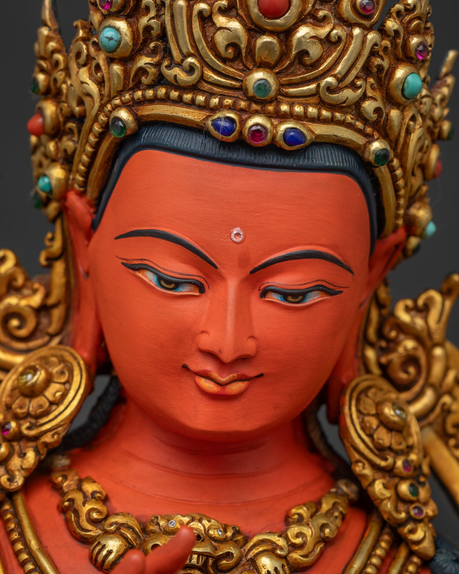 Tikshna Manjushri statue face closeup with five jeweled gold crown detail
