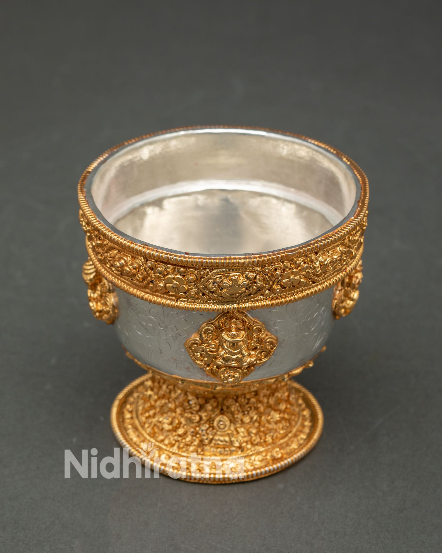 Top view water offering bowl set displaying symmetrical arrangement of seven ritual vessels with gold silver plated finish