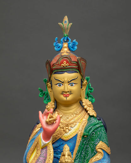 Tsokye Dorje statue featuring a 24K gold painted face and traditional lotus hat with vulture feather finial.