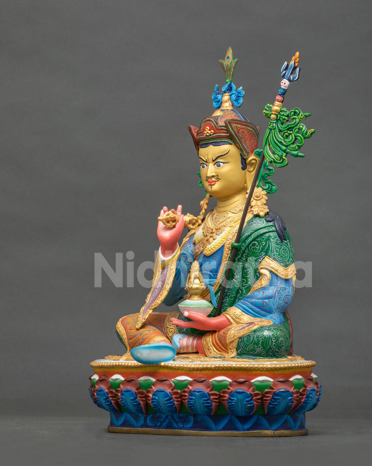 Tsokye Dorje statue with an intricately patterned multicolor royal garment and vibrant acrylic painted details.