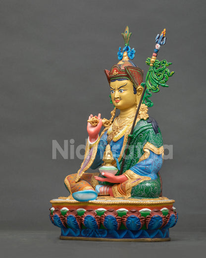 Tsokye Dorje statue with an intricately patterned multicolor royal garment and vibrant acrylic painted details.