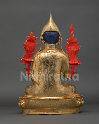 back view of handcrafted tsongkhapa statue showing detailed robe carving and traditional nepalese metalwork