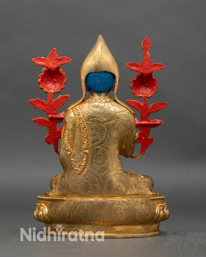 back view of tsongkhapa statue showing detailed robes and lotus pedestal base