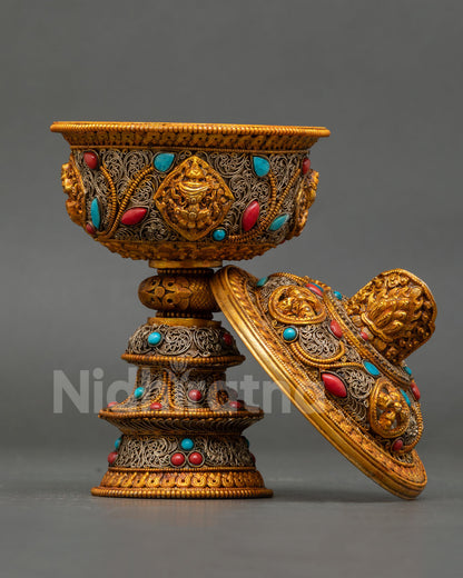 Turquoise and coral semi-precious stones set in marquise and cabochon cuts on Tibetan ritual butter lamp body
