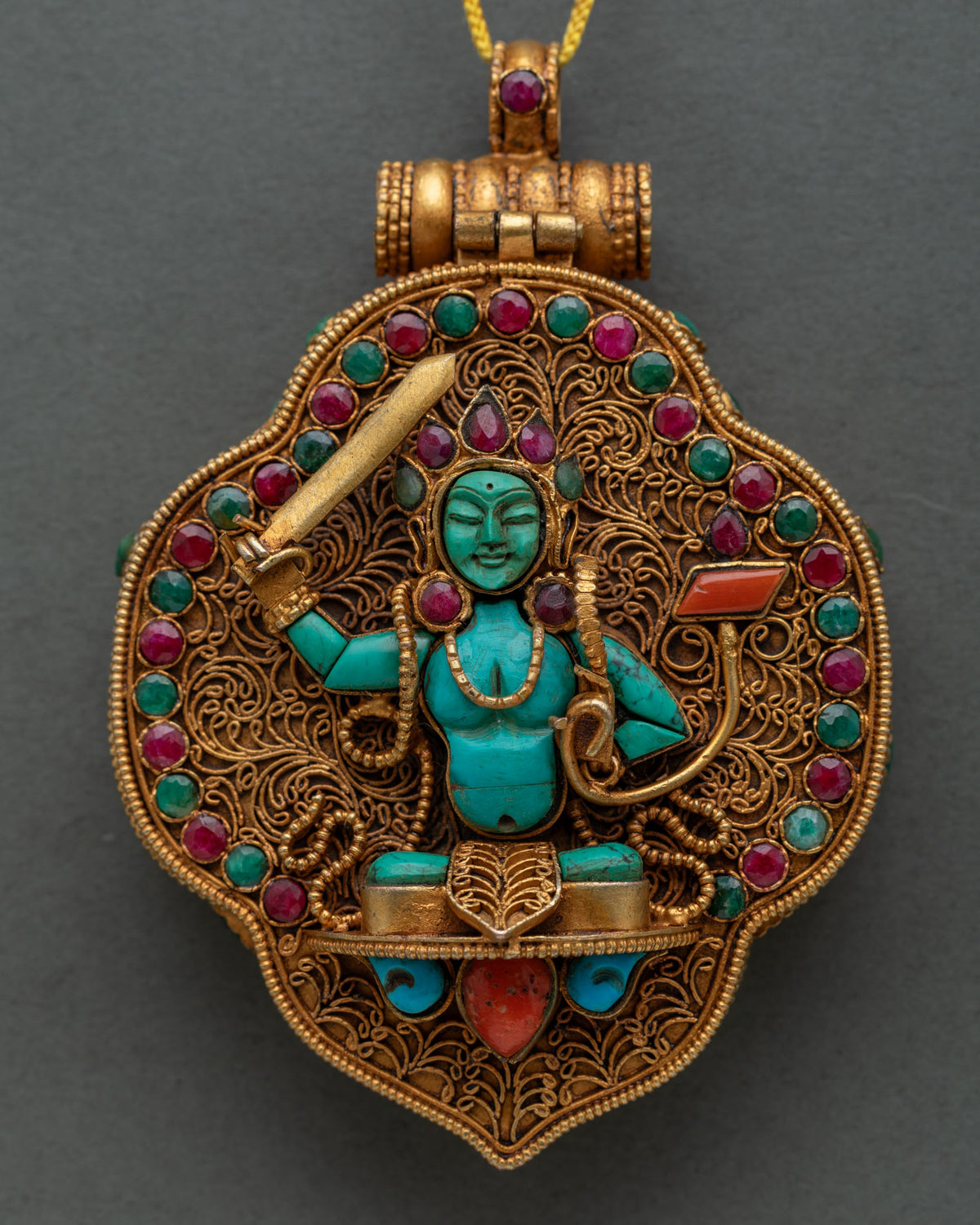 Turquoise Manjushri carved on gold filigree Ghau Mala with coral and gemstone accents