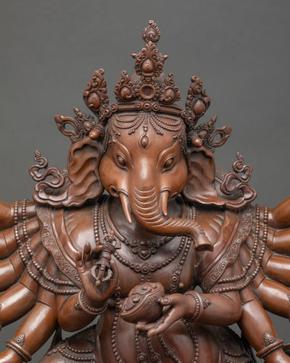 twelve-armed Lord Ganesh sculpture, elephant-headed Hindu god, oxidized copper