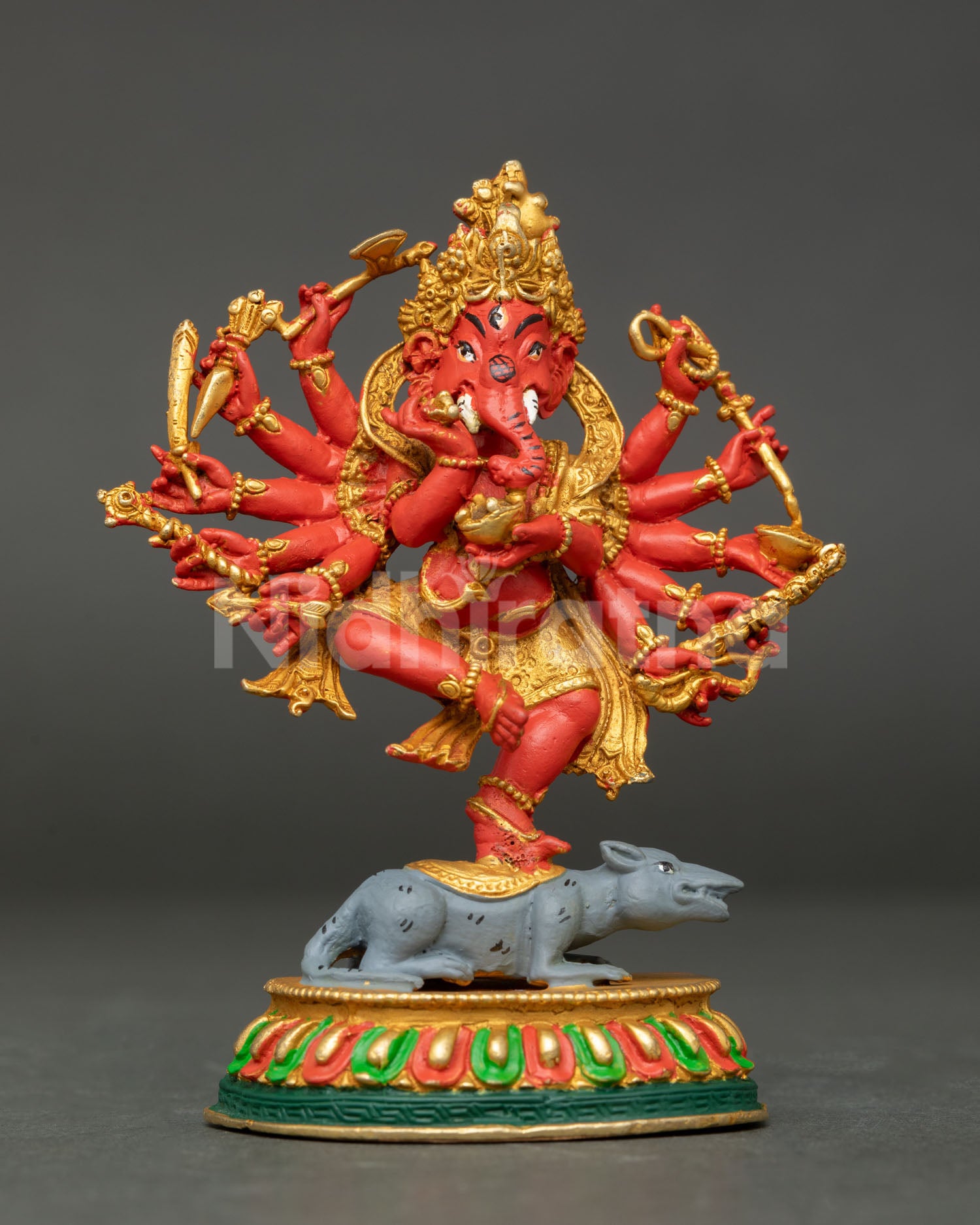 Twelve hand ganesha sculpture holding sacred objects with intricate nepali craftsmanship.