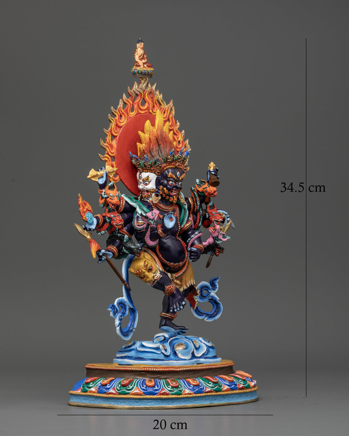 Ucchusma statue with multicolored lotus pedestal and flaming halo.