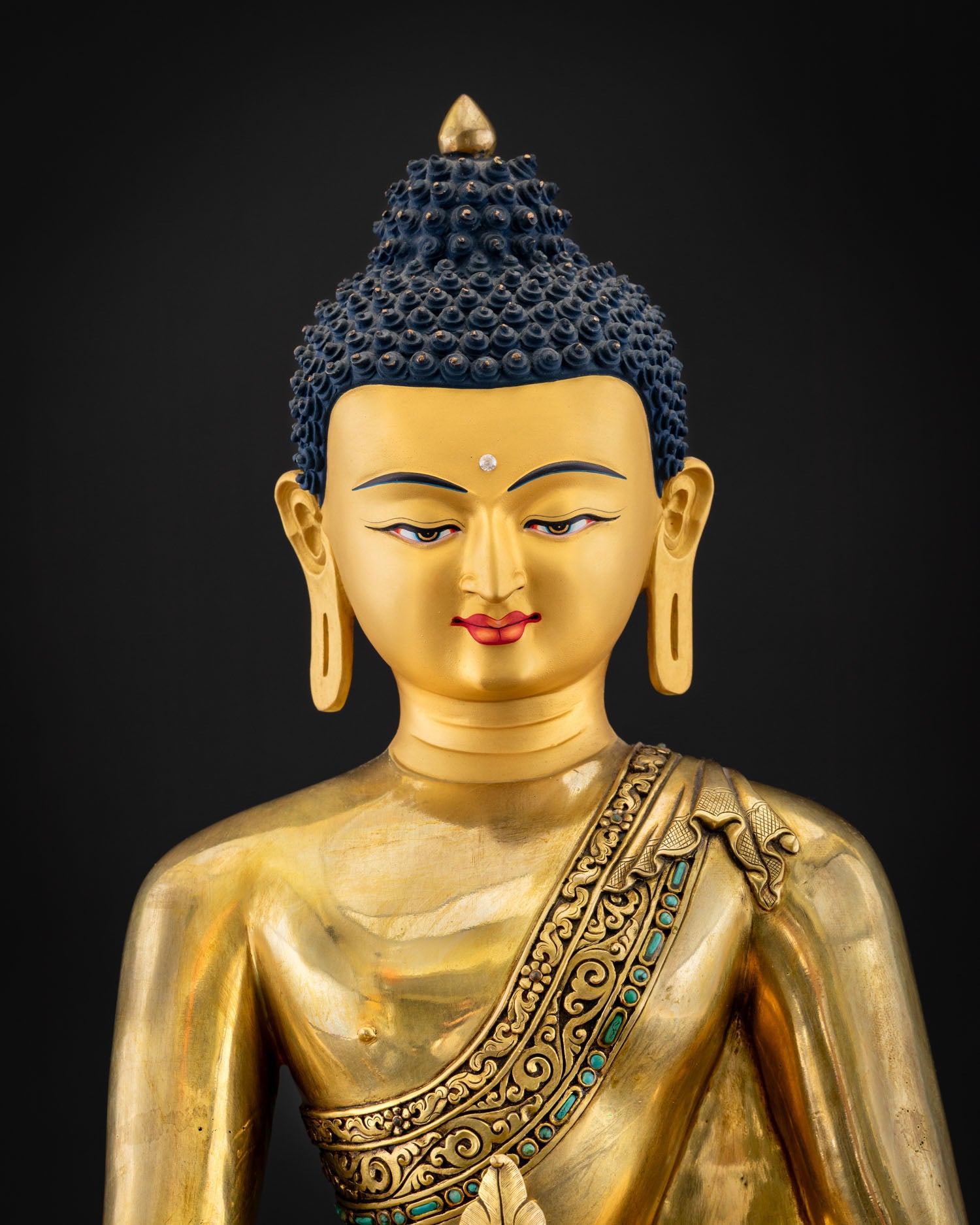 Upper body of gilded Bhaisajyaguru with turquoise-inlaid robe and tranquil gold-painted face, Nepal