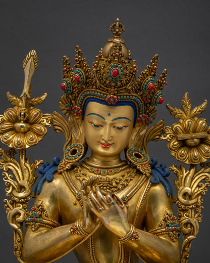 Upper body view of Tikshna Manjushri statue holding lotus stems in Dharmachakra mudra