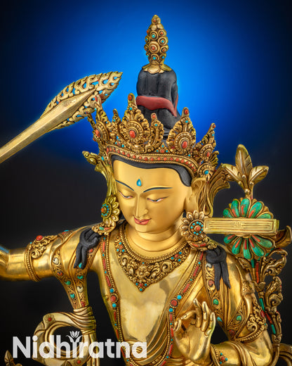upper close up Manjushri statue serene face gold-gilded copper alloy artwork
