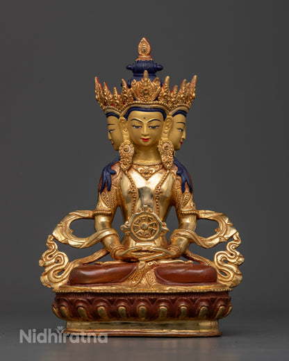 Vairocana Buddha Statue front view with four serene faces and ornate jeweled headdress.
