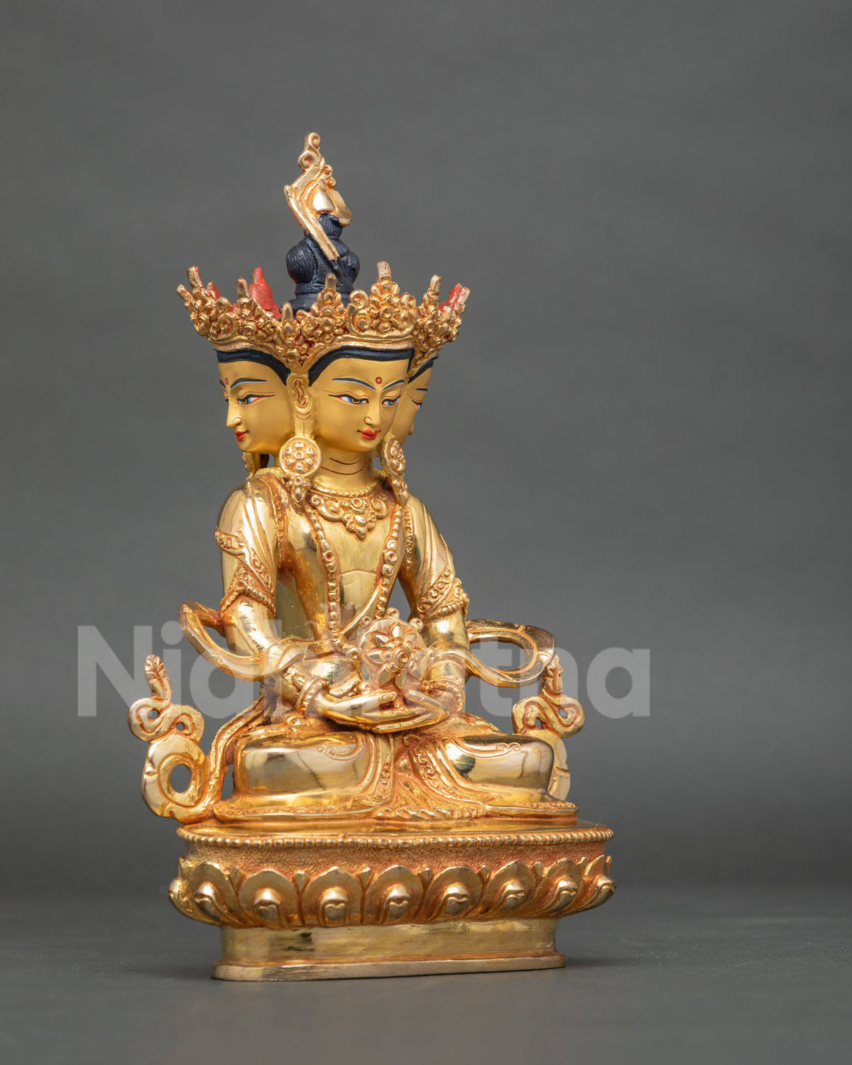 Vairocana Buddha Statue side view ornate jeweled headdress gold finish.