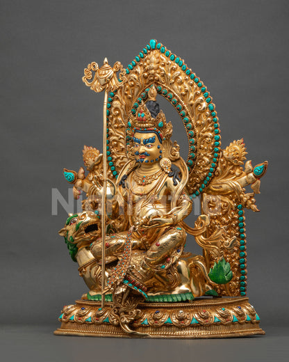 vaisravana namtoshe statue left side view with victory banner and jewel spitting mongoose