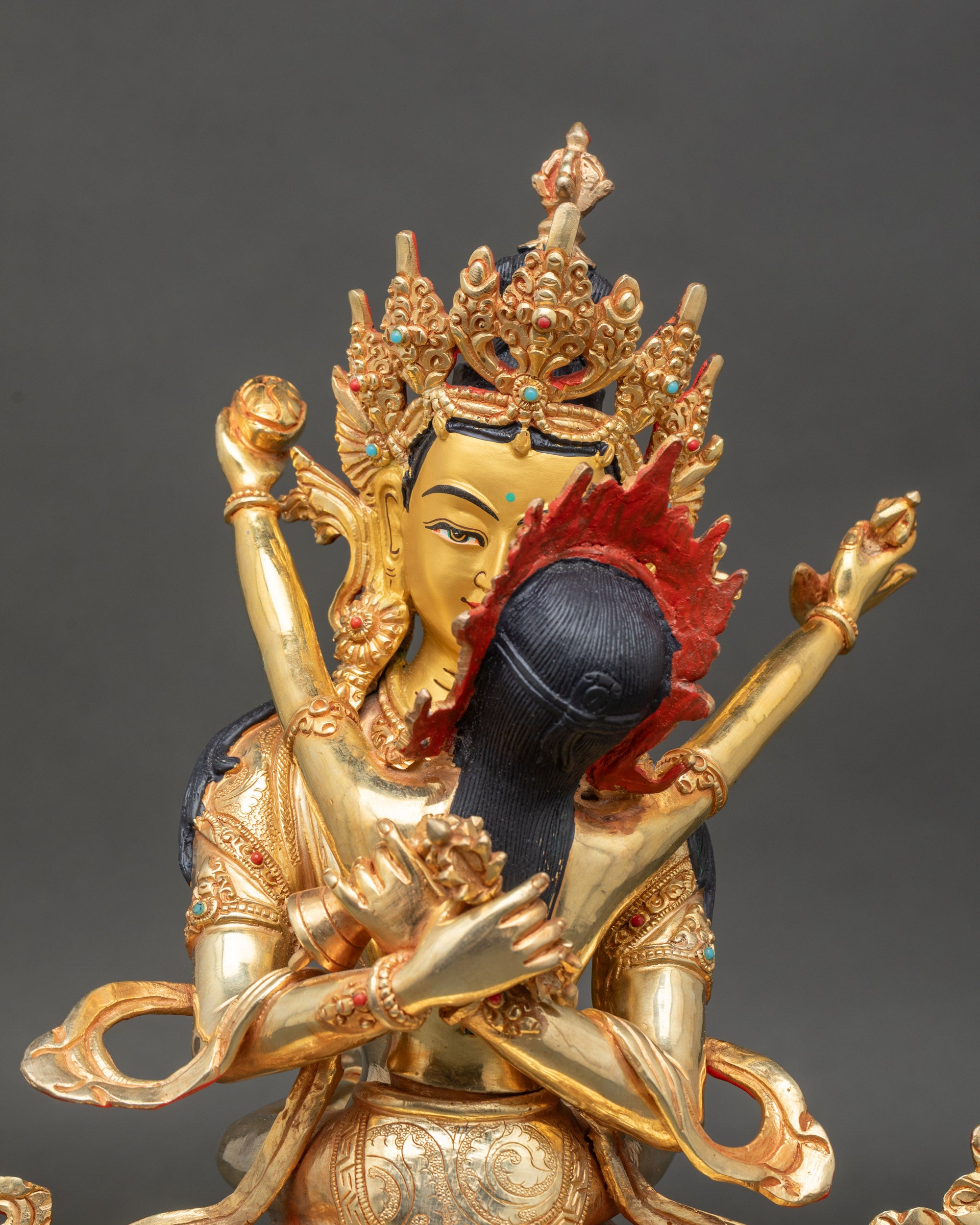 vajradhara-and-consort-statue-close-up-gold-painted-faces-semi-precious-stones