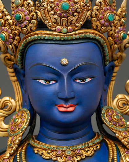 Vajradhara Buddha face close up with serene expression and jeweled crown details