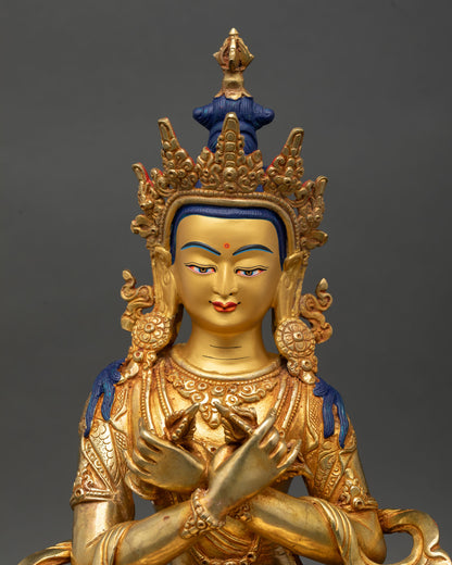 Vajradhara statue, close-up gold-painted face, intricate details, newari craftsmanship, Patan, Nepal, sacred sculpture