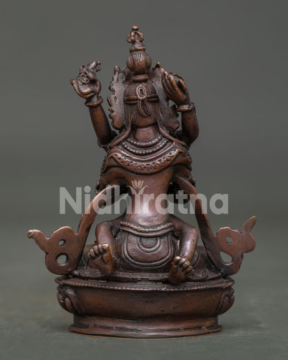 Vajradhara with consort statue back view showing handcarved silk garments.