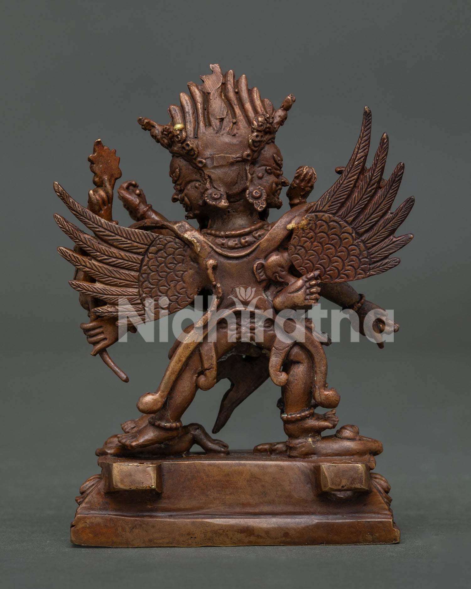 Vajrakilaya statue with consort holding a skull cup and a kartika knife, emphasizing traditional symbolic elements.