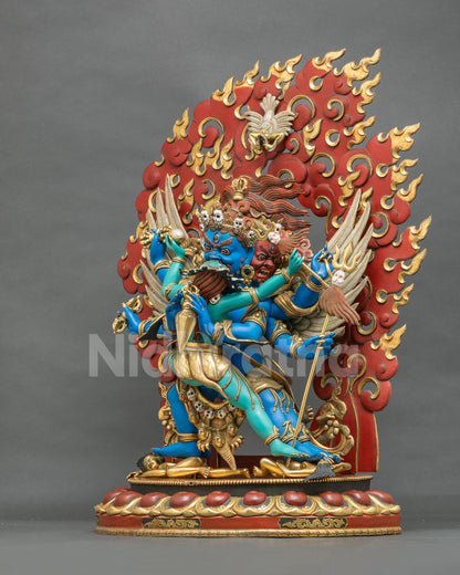 Vajrakilaya with consort side view showing red wrathful face, garuda wings and trident staff