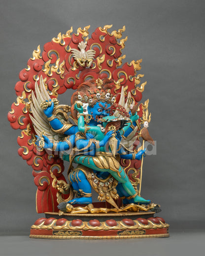 Vajrakilaya Yab-Yum statue angled view with garuda wings, vajra and gold-tipped flame halo