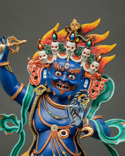 Vajrapani Bodhisattva statue showing blue face, ornate skull crown, jewelry and fierce expression detail