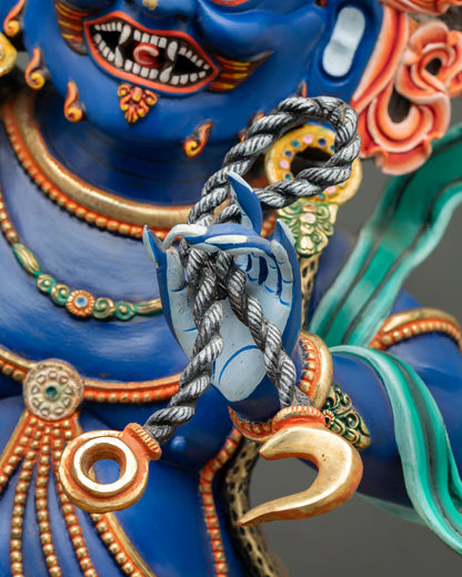 Vajrapani Buddhist statue holding lasso in left hand, symbolizing binding negative forces and obstacles