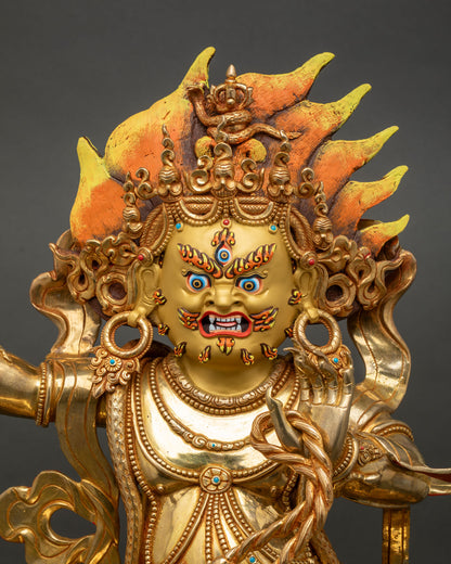 Vajrapani close up radiant 24K gold face turquoise coral stones wrathful deity sculpture