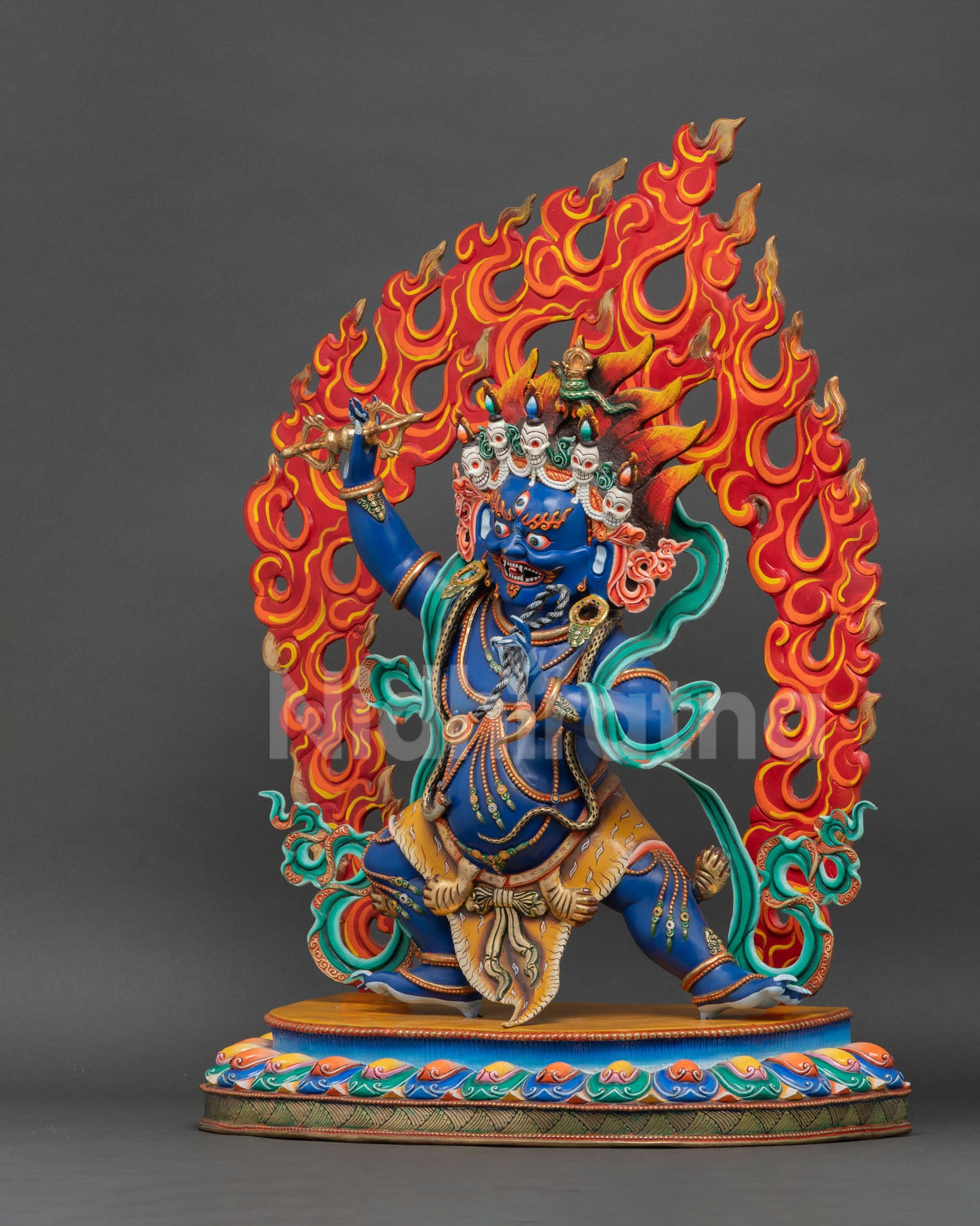 Vajrapani copper statue left side view with ornate scarves, serpent ornaments and jewelry