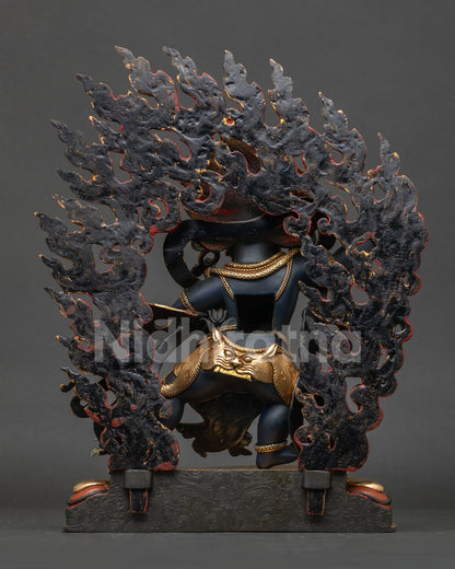Vajrapani statue back view showing flowing patterned robe intricate handcrafted details.