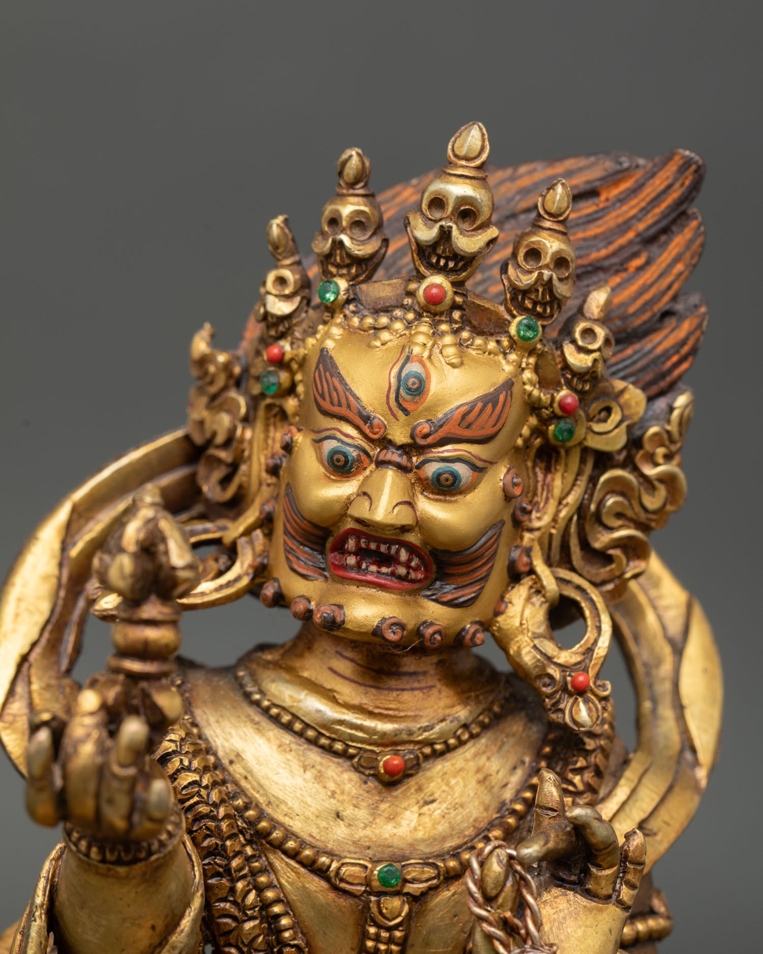 Vajrapani statue close up intricate copper craftsmanship gold gilded finish