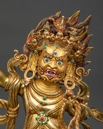 Vajrapani statue close up, vajra, lasso and turquoise-coral jewelry in 24K gold fire-gilded copper