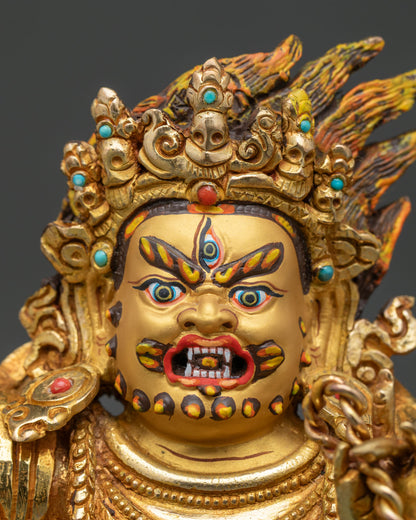 Vajrapani statue face close up 24k gold painted face.