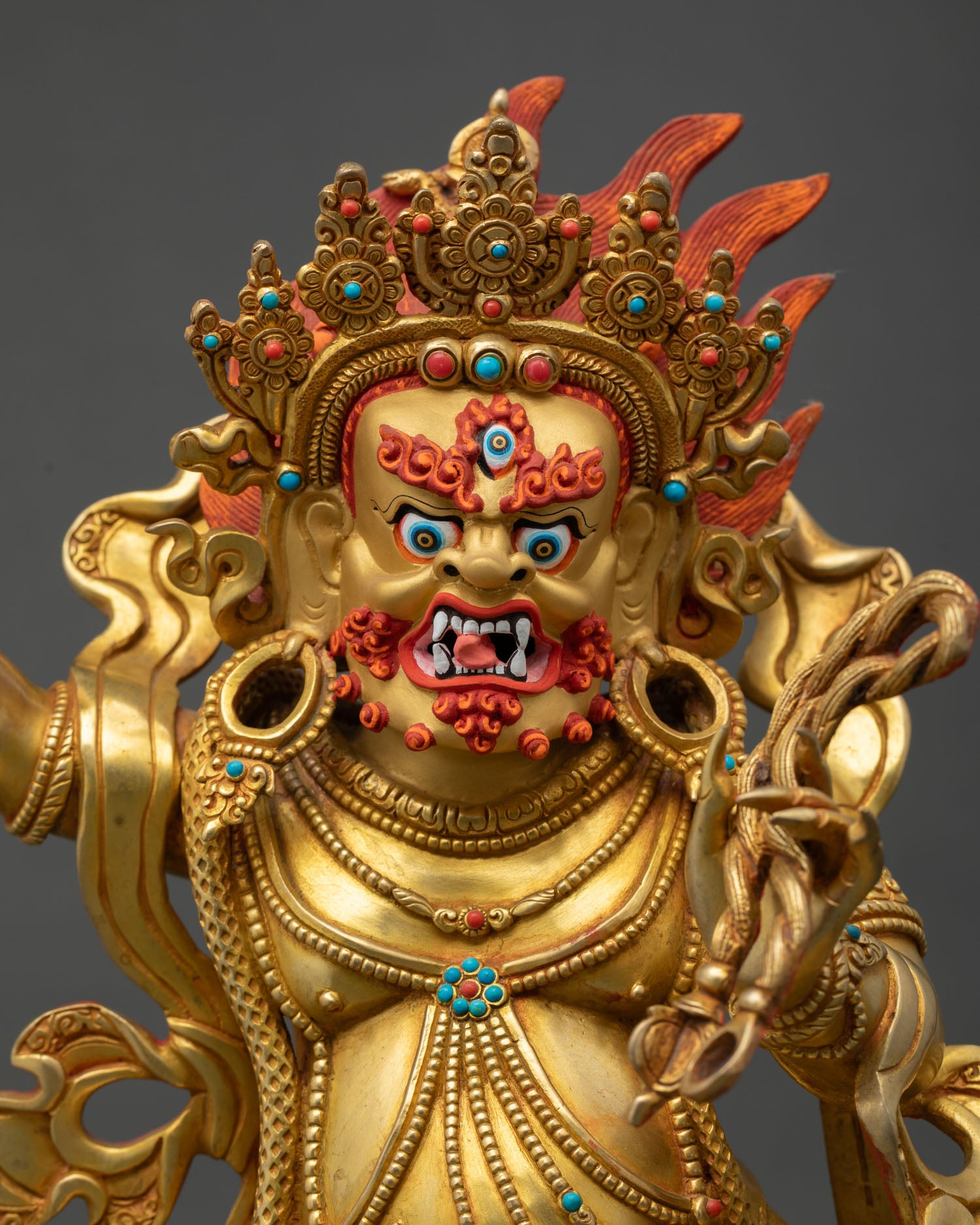 vajrapani statue regular close up, handcrafted nepali copper deity with fire gilded details