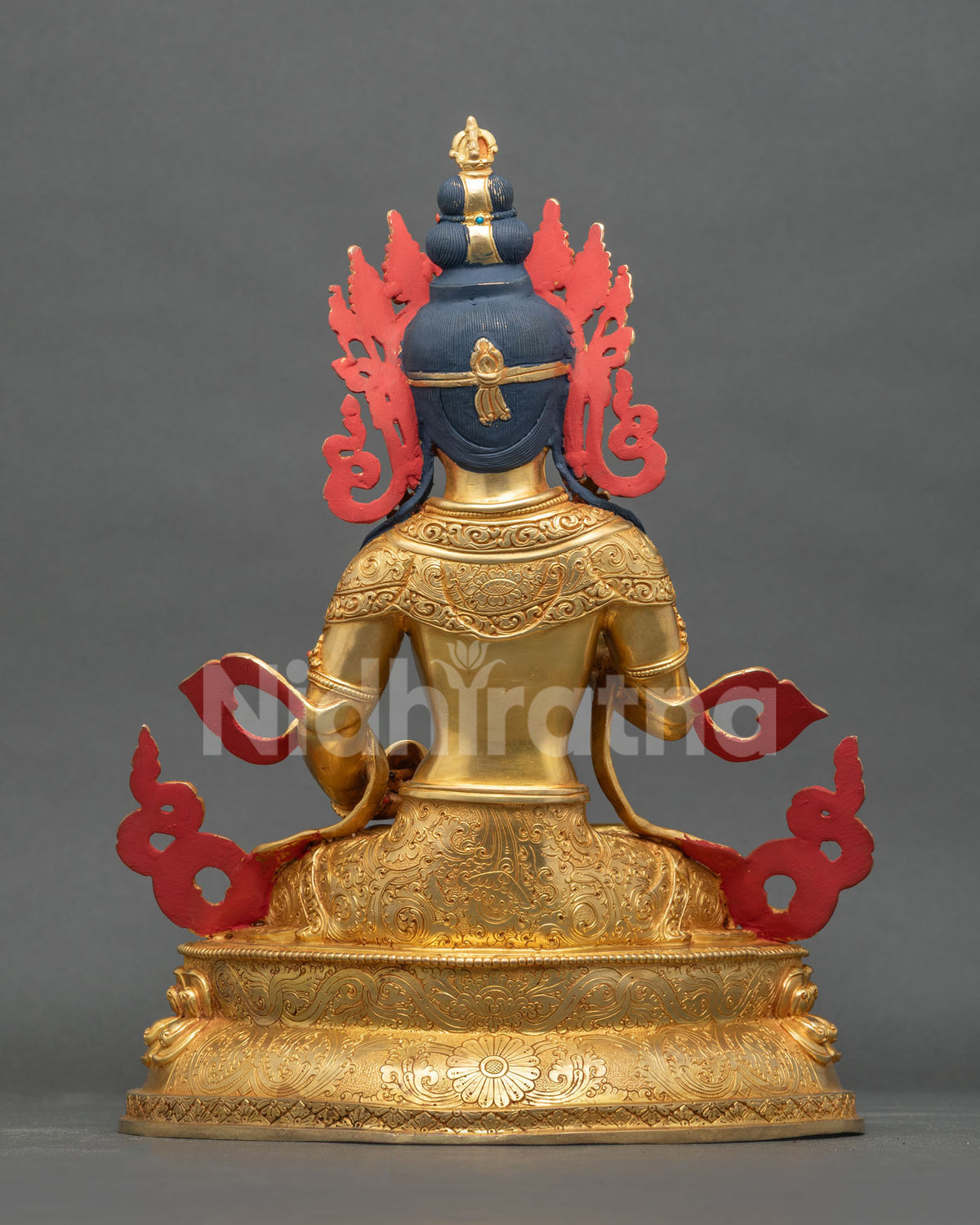 Vajrasattva Buddha statue back view gold fire gilded copper hand carved robe details.