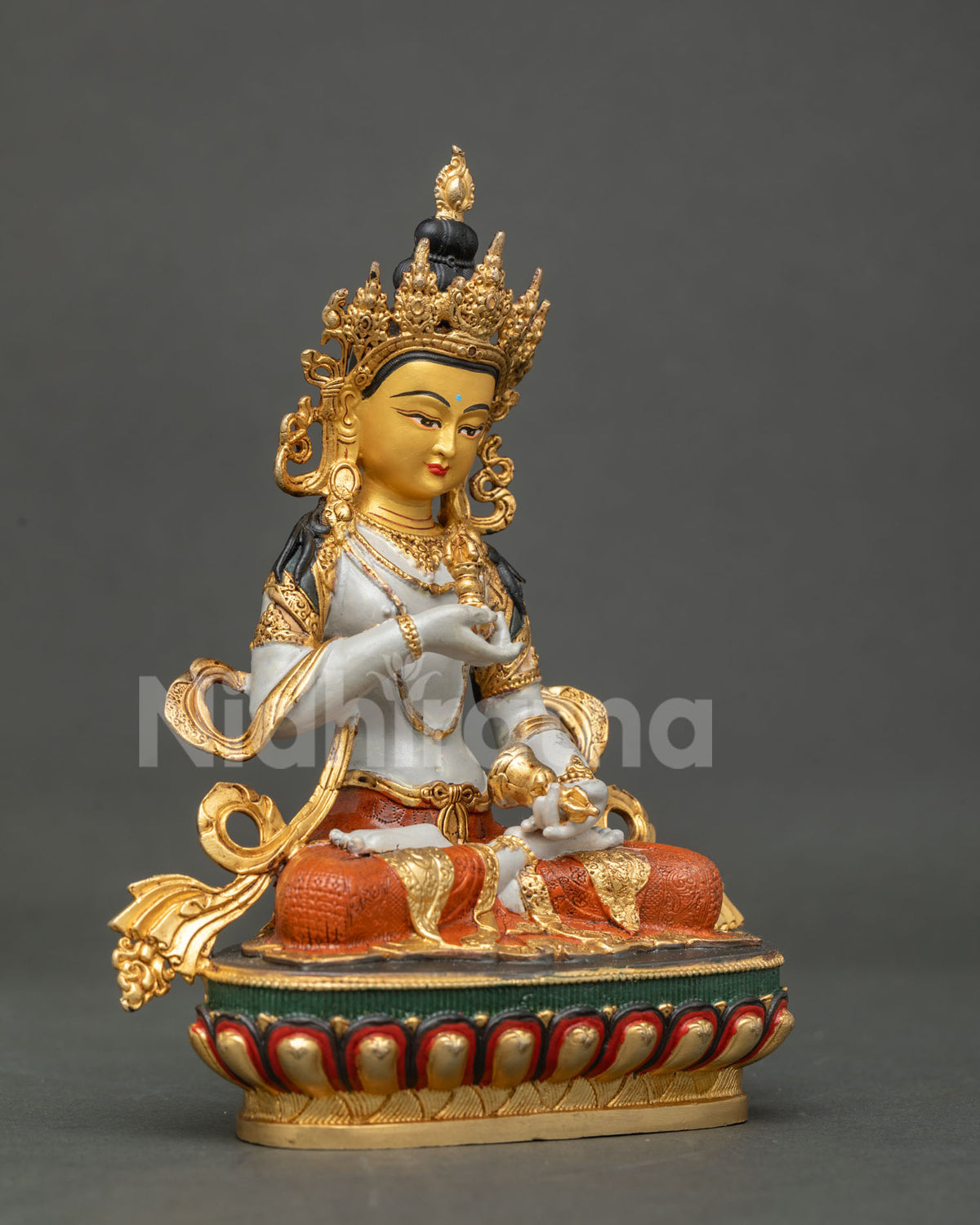 Vajrasattva Buddha statue jewel studded crown celestial ornaments.