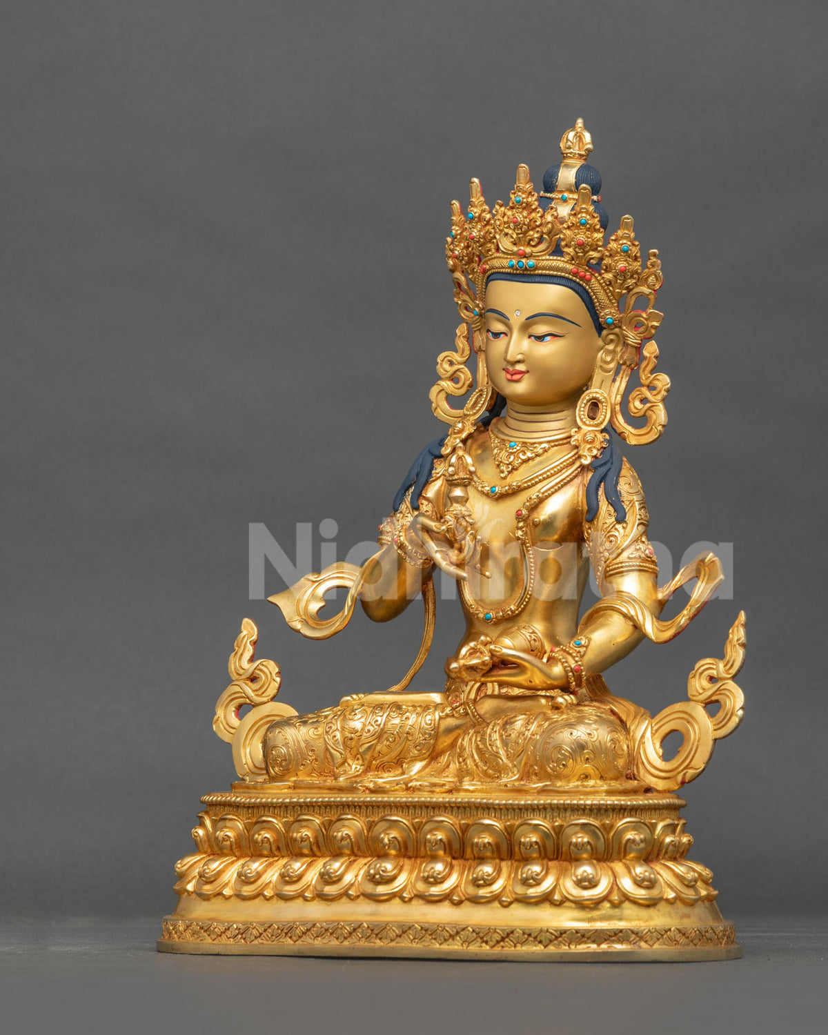 Vajrasattva Buddha statue left view copper gold gilded celestial jewelry engraved robes.