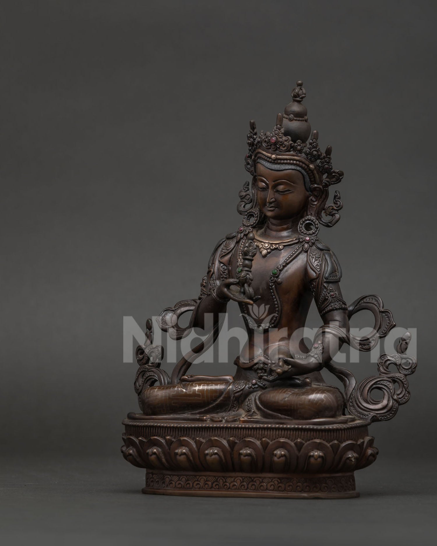 Vajrasattva Buddhist statue seated on hand-carved lotus pedestal with vajra symbol.