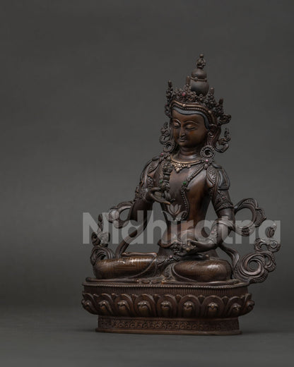 Vajrasattva Buddhist statue seated on hand-carved lotus pedestal with vajra symbol.