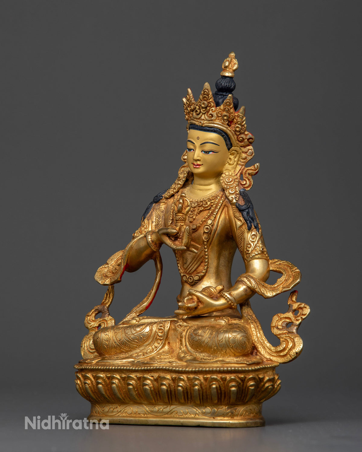 Vajrasattva Buddhist Statue with five jewel crown and flowing robe.