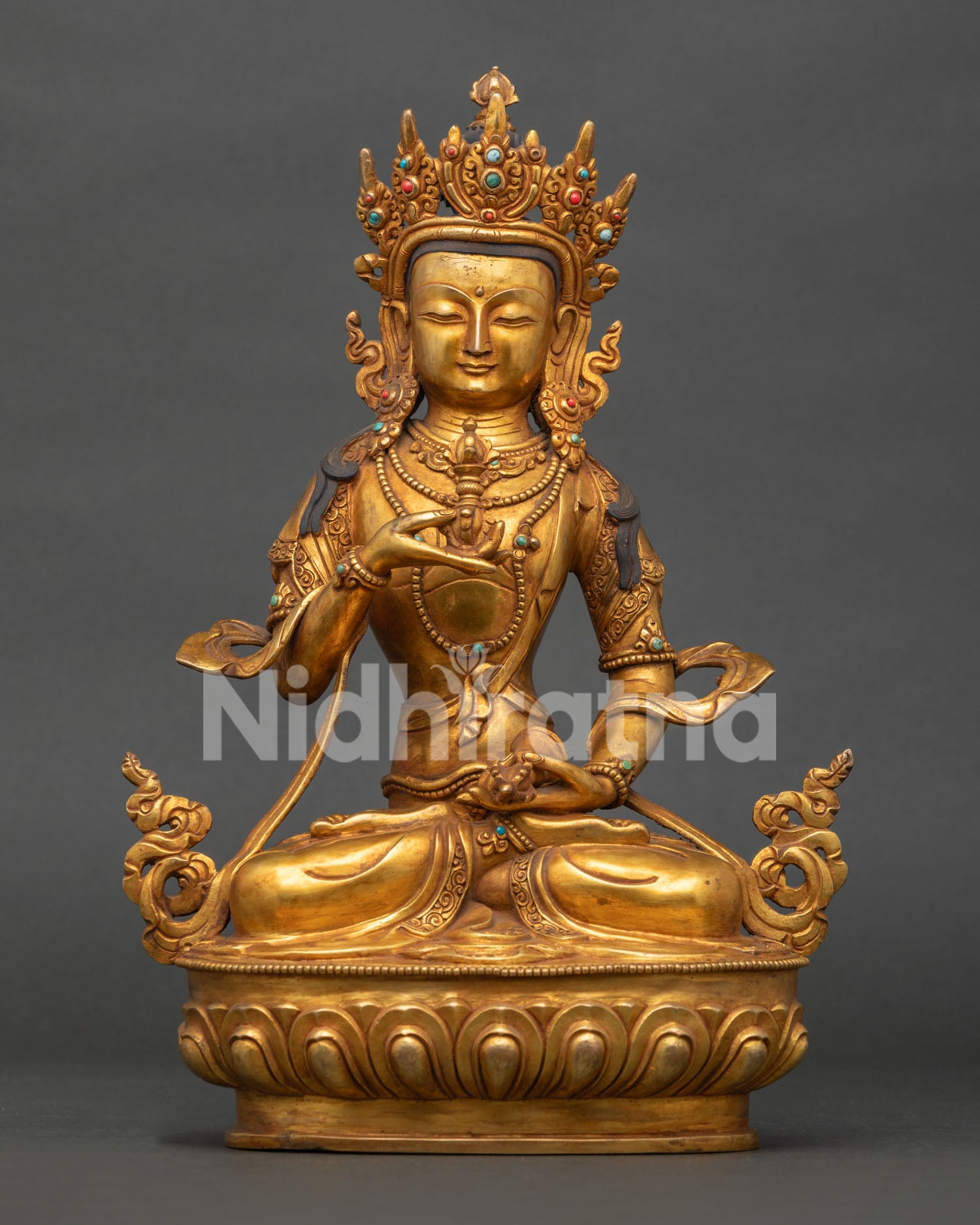 Vajrasattva holding five-pronged vajra and ritual bell in Vajraparyanka posture.