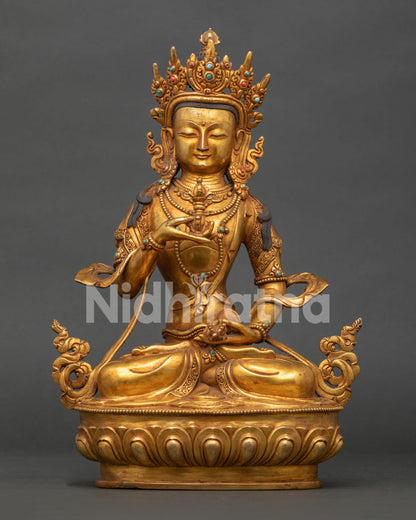 Vajrasattva holding five-pronged vajra and ritual bell in Vajraparyanka posture.